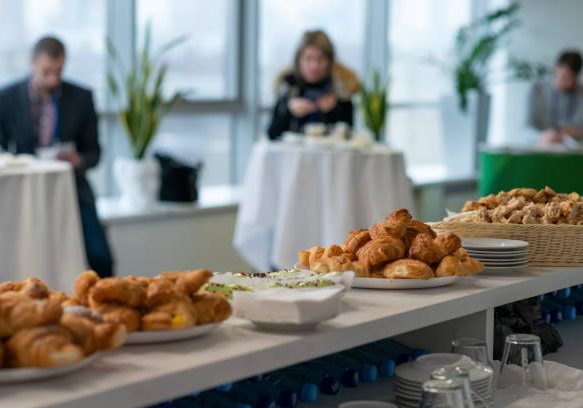Table with cakes during a coffee break.