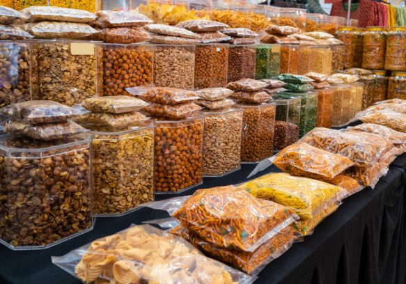 Variety types of Indian snacks selling at the booth.